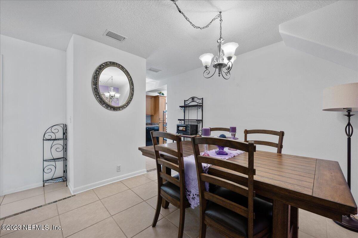 113 Leaf Street San Mateo, FL 32187 - Photo 13 of 32 a view of a dining room with furniture