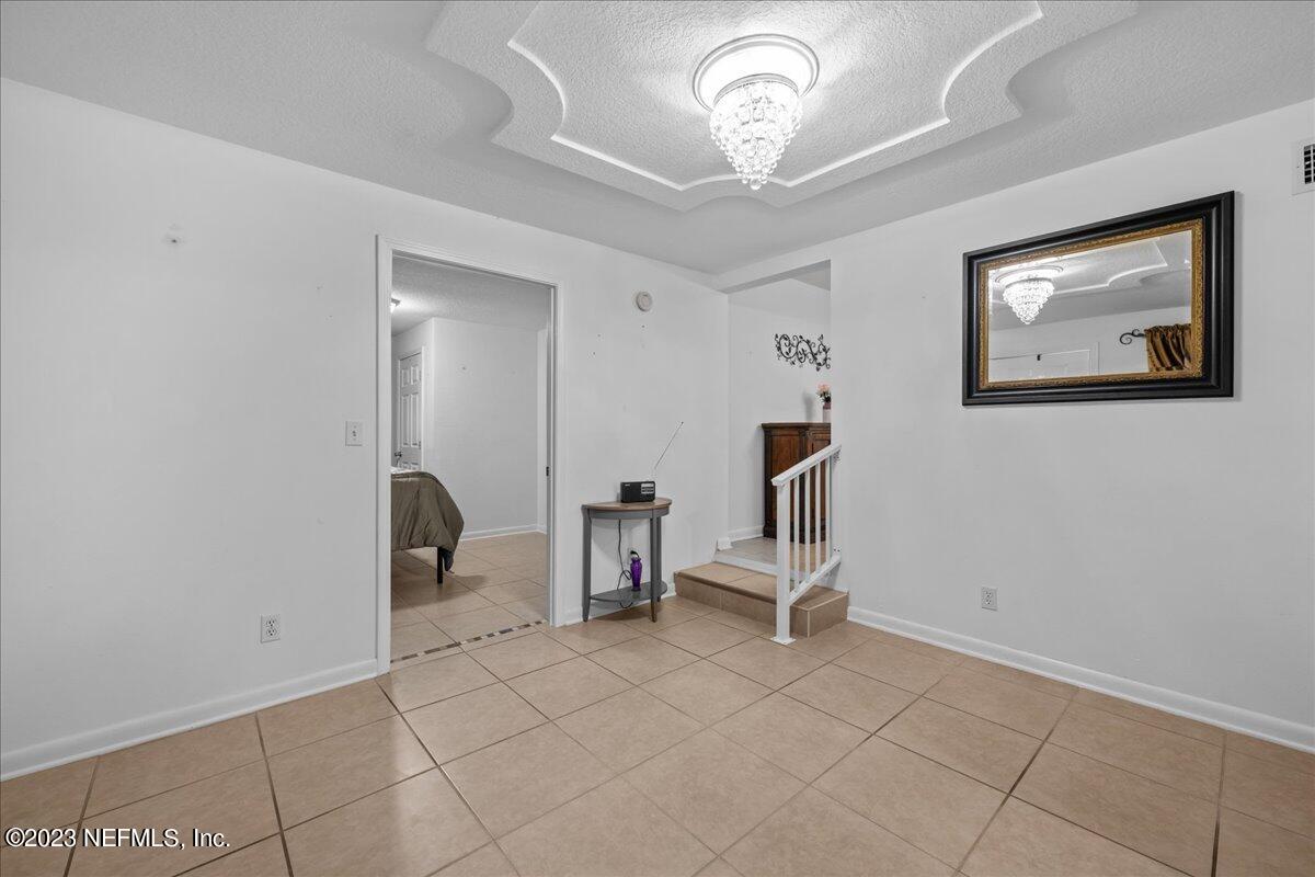 113 Leaf Street San Mateo, FL 32187 - Photo 22 of 32 a view of an empty room with a window