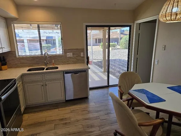 a kitchen with sink and window