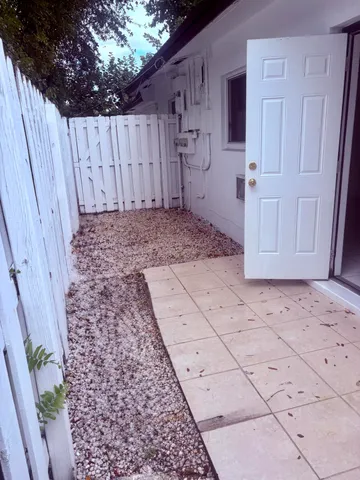 a view of a backyard of the house