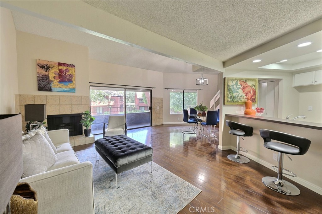 348 South Prospectors Road, Unit 10 Diamond Bar, CA 91765 - Photo 1 of 1 a living room with furniture and a fireplace
