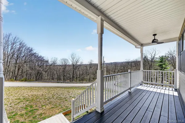 a view of balcony with wooden floor
