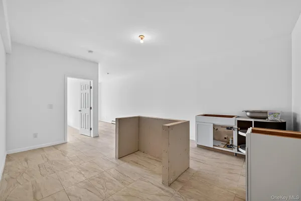 a view of a livingroom with a kitchen