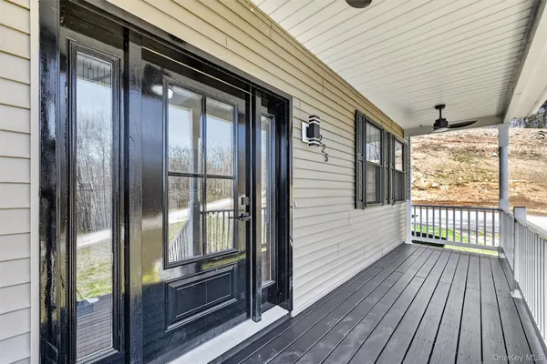 a view of a balcony with wooden floor