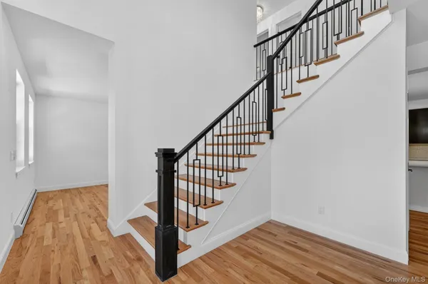 a view of entryway with wooden floor