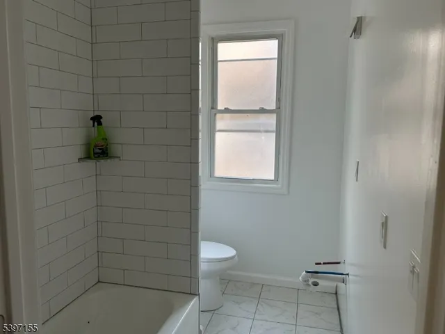 a bathroom with a toilet