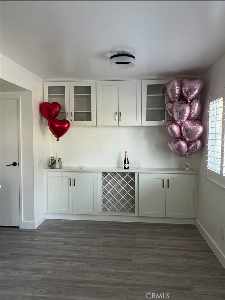 1301 West 8th Street Upland, CA 91786 - Photo 2 of 12 a view of cabinets and wooden floor