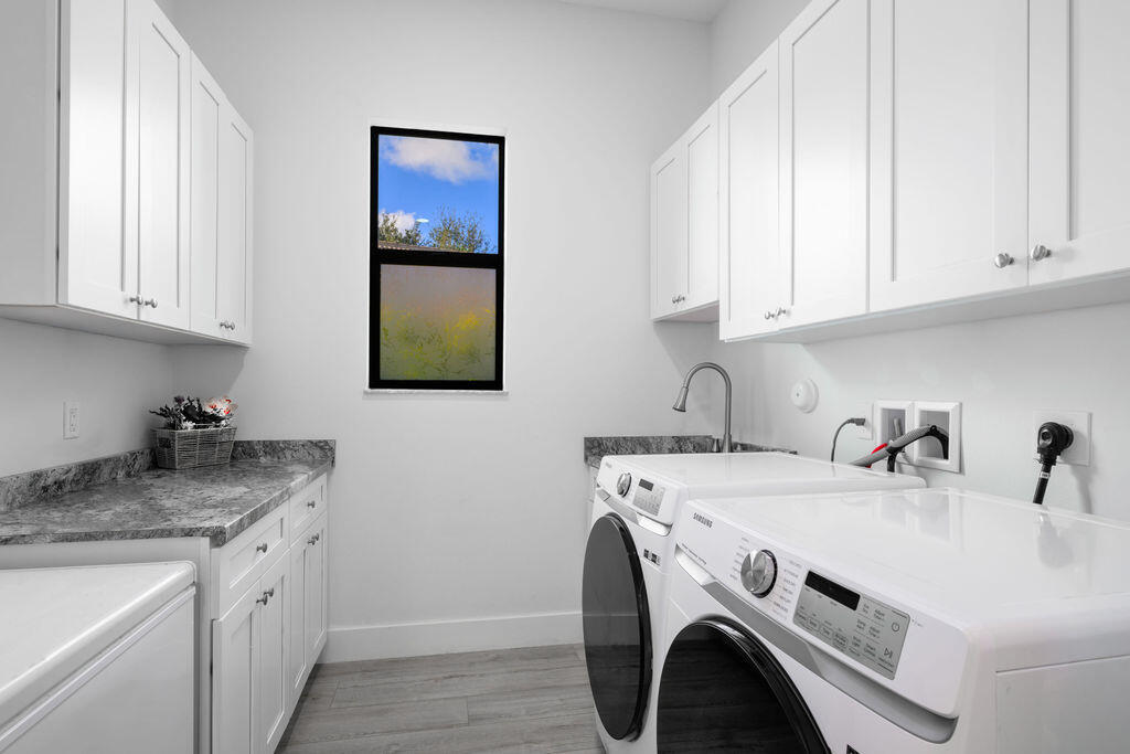 1155 Southwest Bent Pine Cove Port St. Lucie, FL 34986 - Photo 18 of 25 Laundry