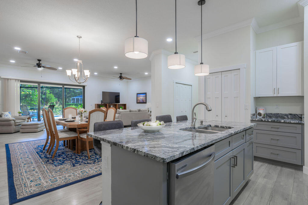 1155 Southwest Bent Pine Cove Port St. Lucie, FL 34986 - Photo 3 of 25 Kitchen to pool