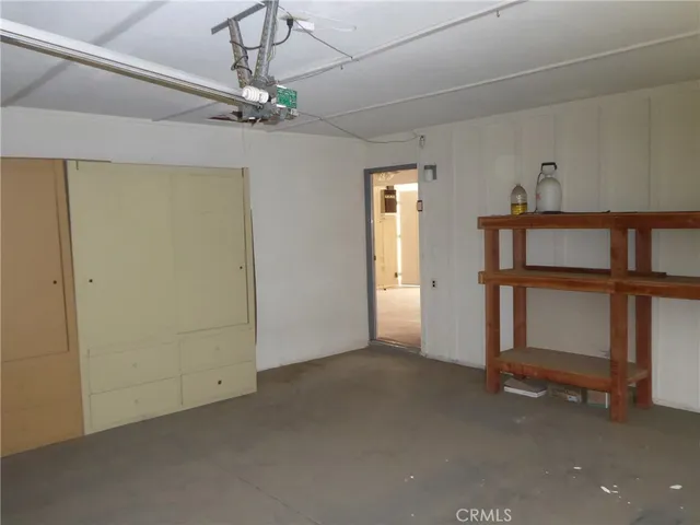 a view of a room that has a small yard