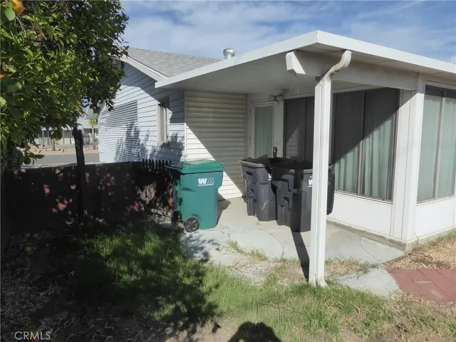 a view of a porch with wooden floor and stairs