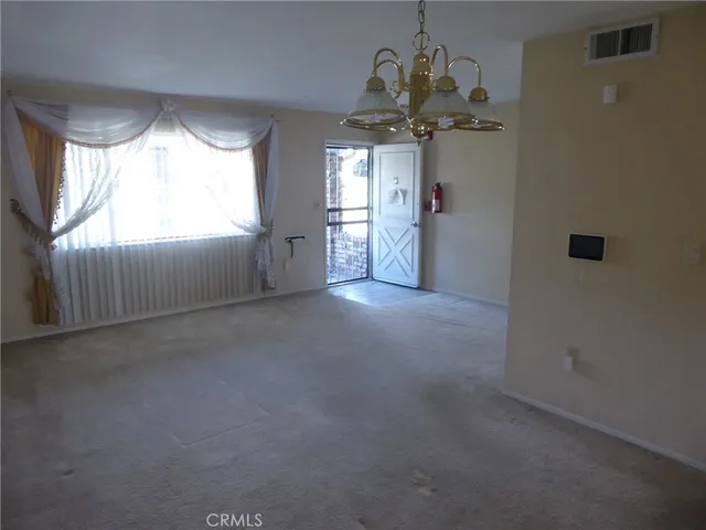 a view of a windows and chandelier in a room