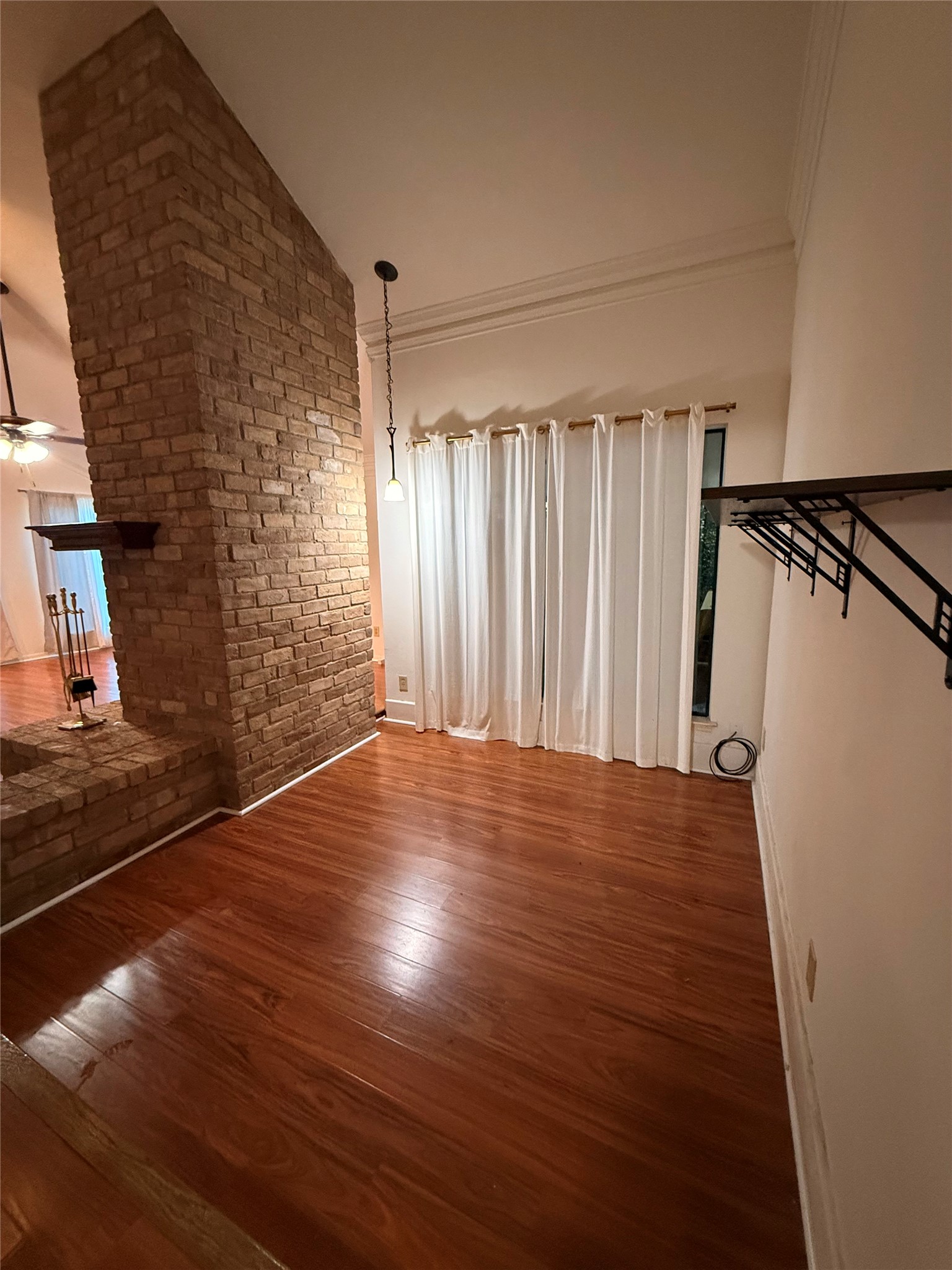 2311 Peppermill Road Houston, TX 77080 - Photo 3 of 18 a view of a livingroom with wooden floor and stairs