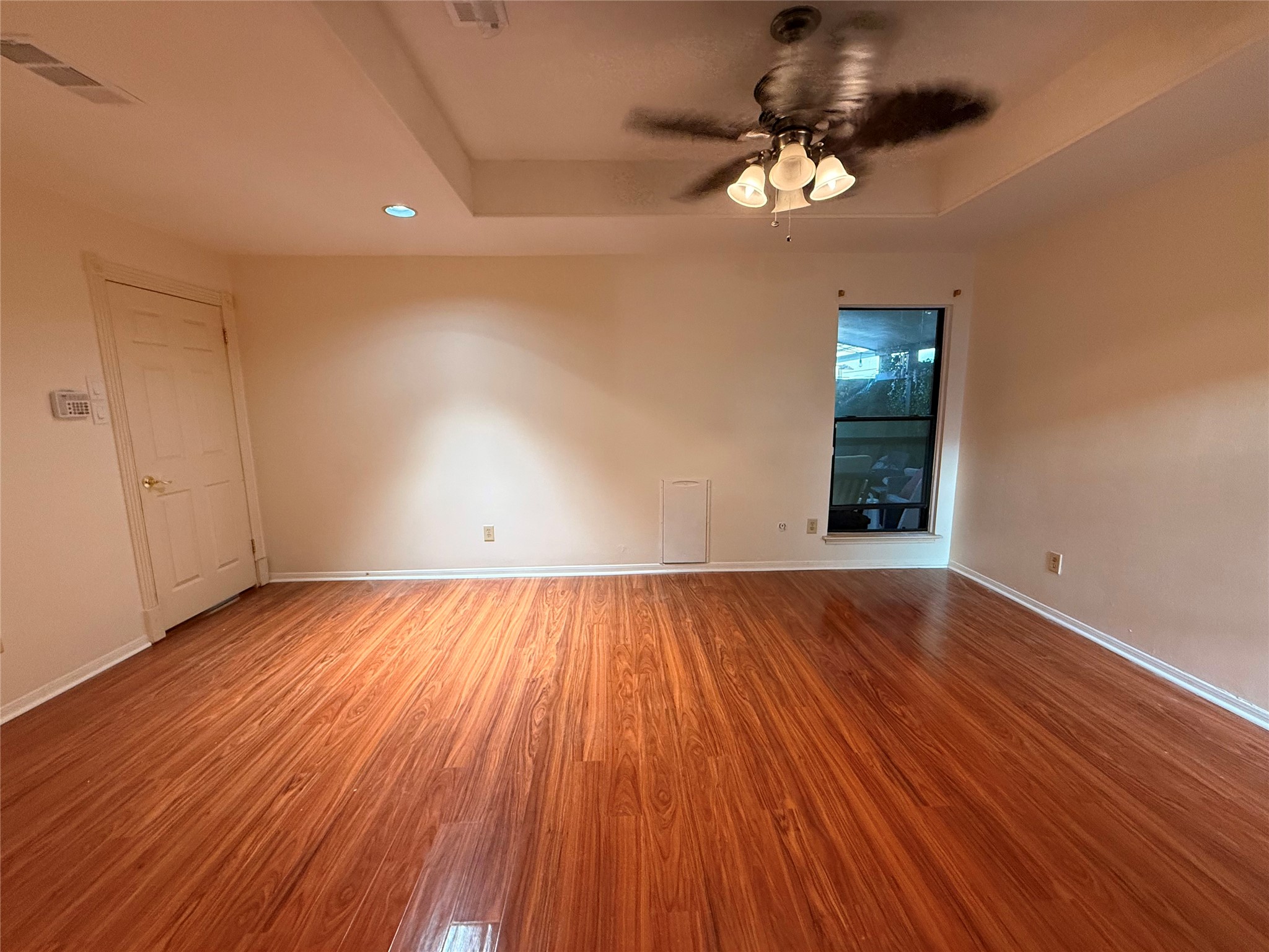 2311 Peppermill Road Houston, TX 77080 - Photo 10 of 18 wooden floor in an empty room with a window