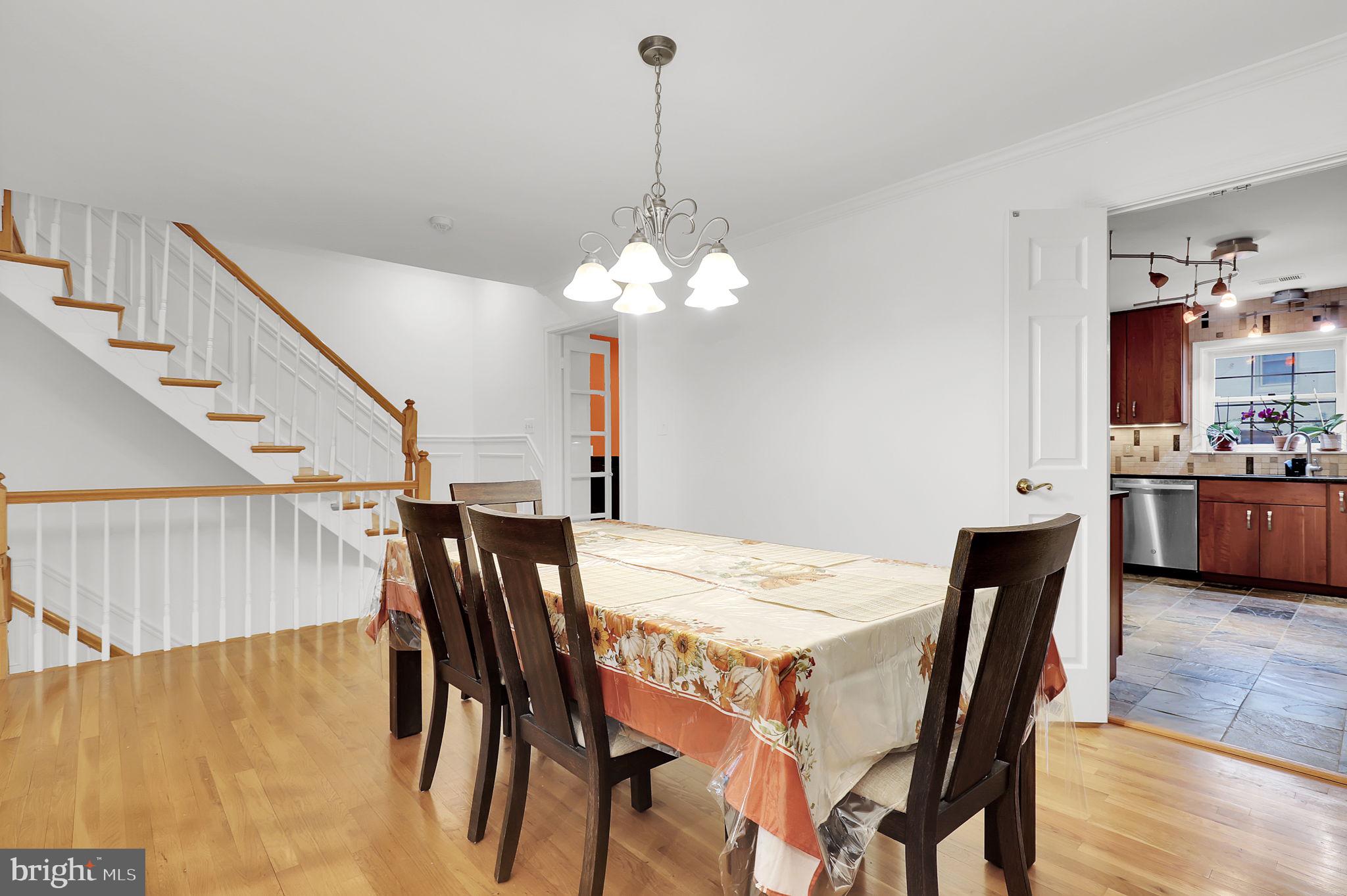 10804 Brewer House Road Rockville, MD 20852 - Photo 12 of 79 a view of a dining room with furniture and wooden floor