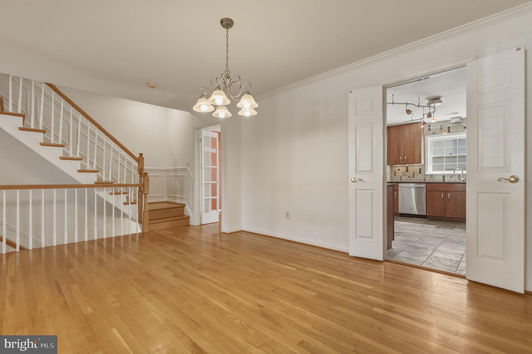 10804 Brewer House Road Rockville, MD 20852 - Photo 17 of 79 a view of a livingroom with wooden floor and kitchen space