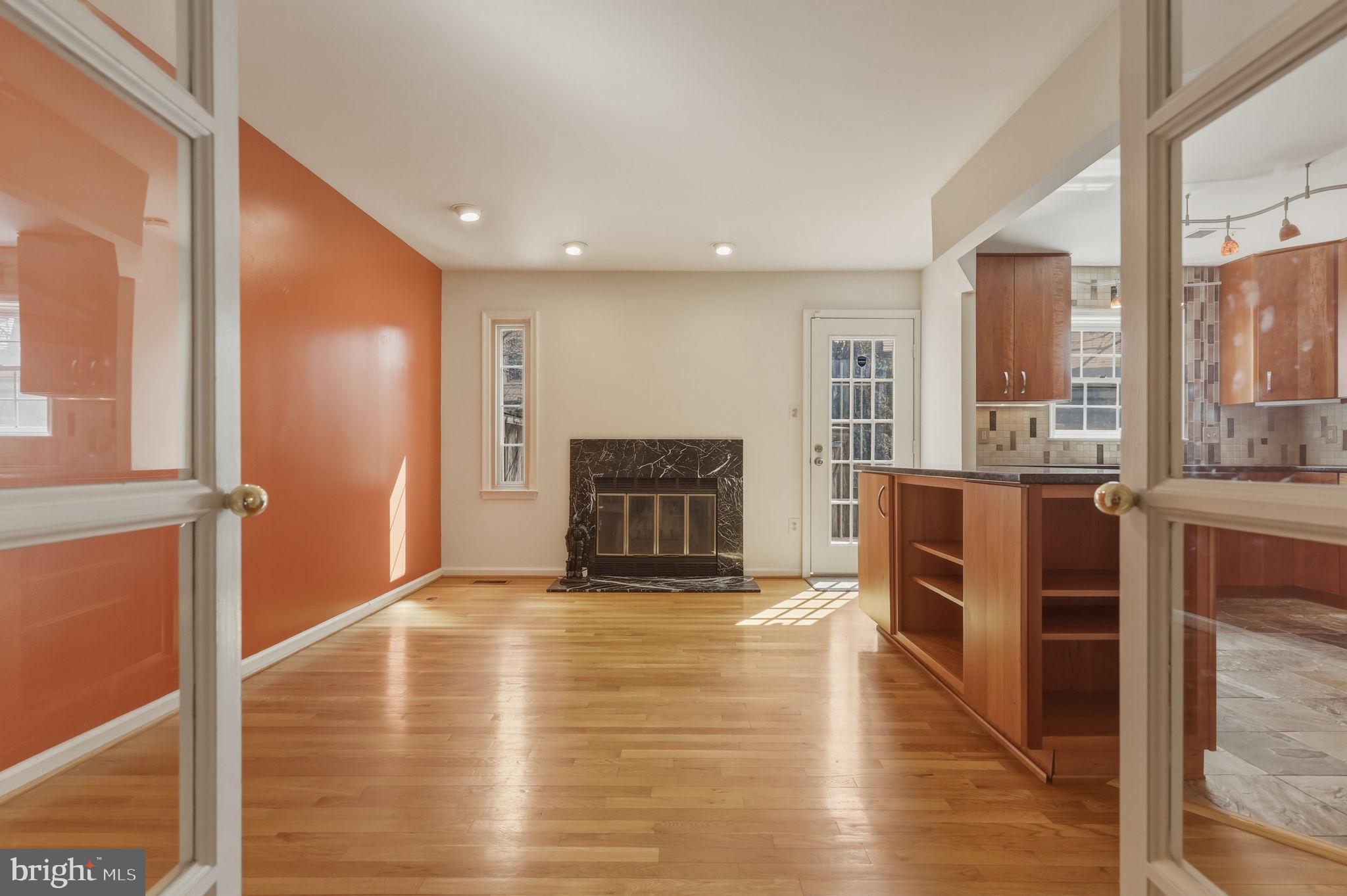 10804 Brewer House Road Rockville, MD 20852 - Photo 22 of 79 a view of a living room with wooden floor and kitchen view