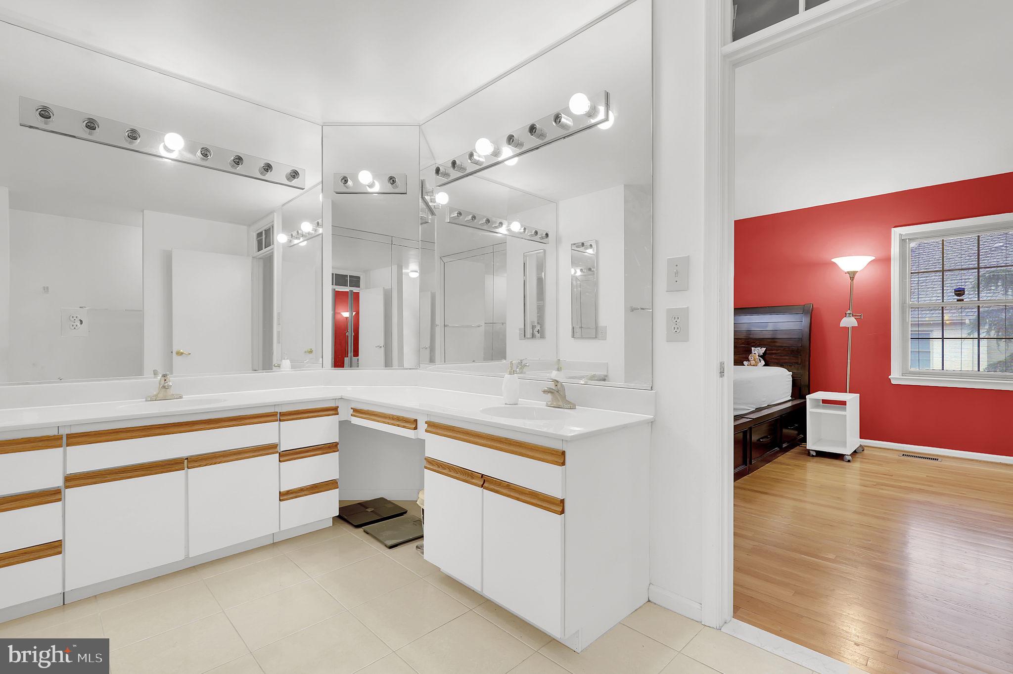 10804 Brewer House Road Rockville, MD 20852 - Photo 23 of 39 a large white kitchen with a large stove a sink and a refrigerator