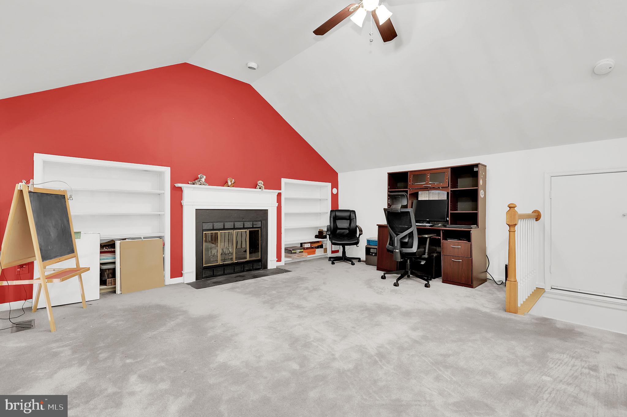 10804 Brewer House Road Rockville, MD 20852 - Photo 25 of 39 a view of a livingroom with furniture and a fireplace