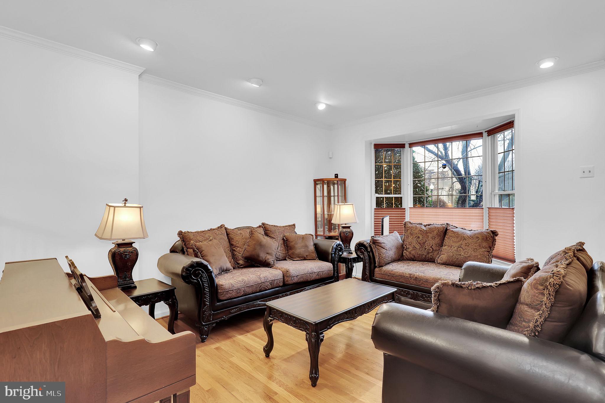 10804 Brewer House Road Rockville, MD 20852 - Photo 3 of 39 a living room with furniture and a couch