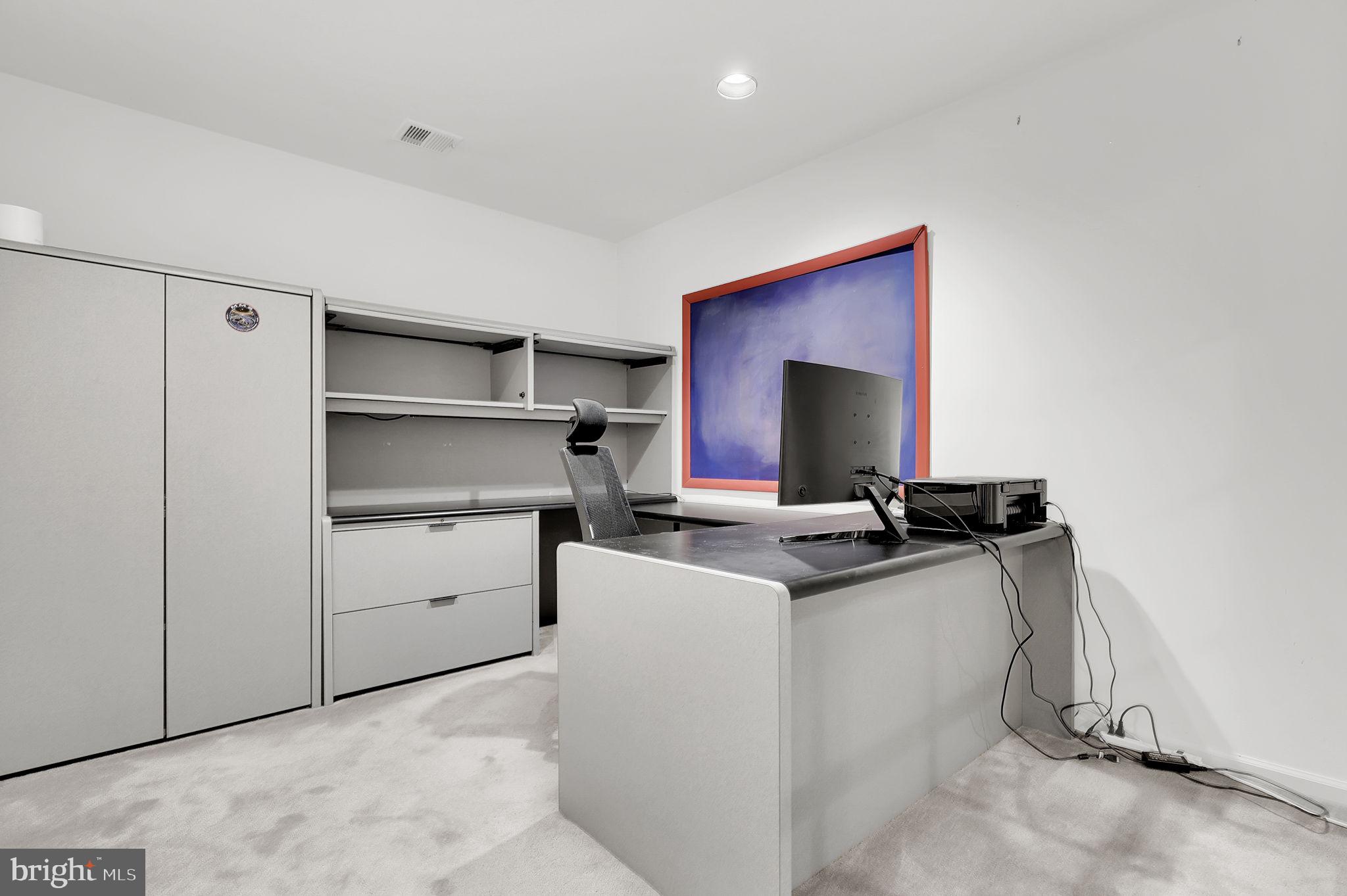 10804 Brewer House Road Rockville, MD 20852 - Photo 33 of 39 a room with a chair and appliances