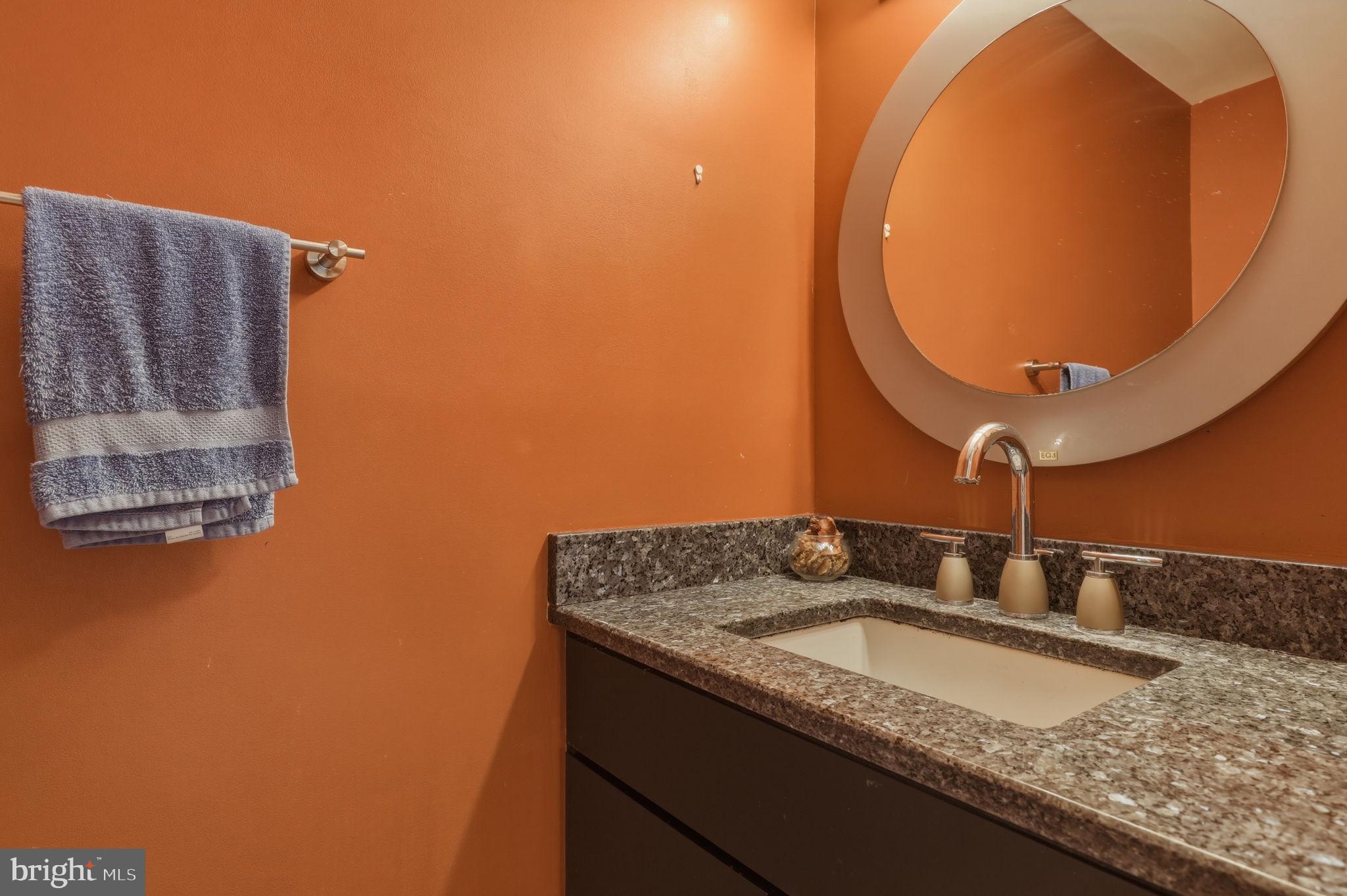 10804 Brewer House Road Rockville, MD 20852 - Photo 35 of 79 a bathroom with a granite countertop sink and mirror