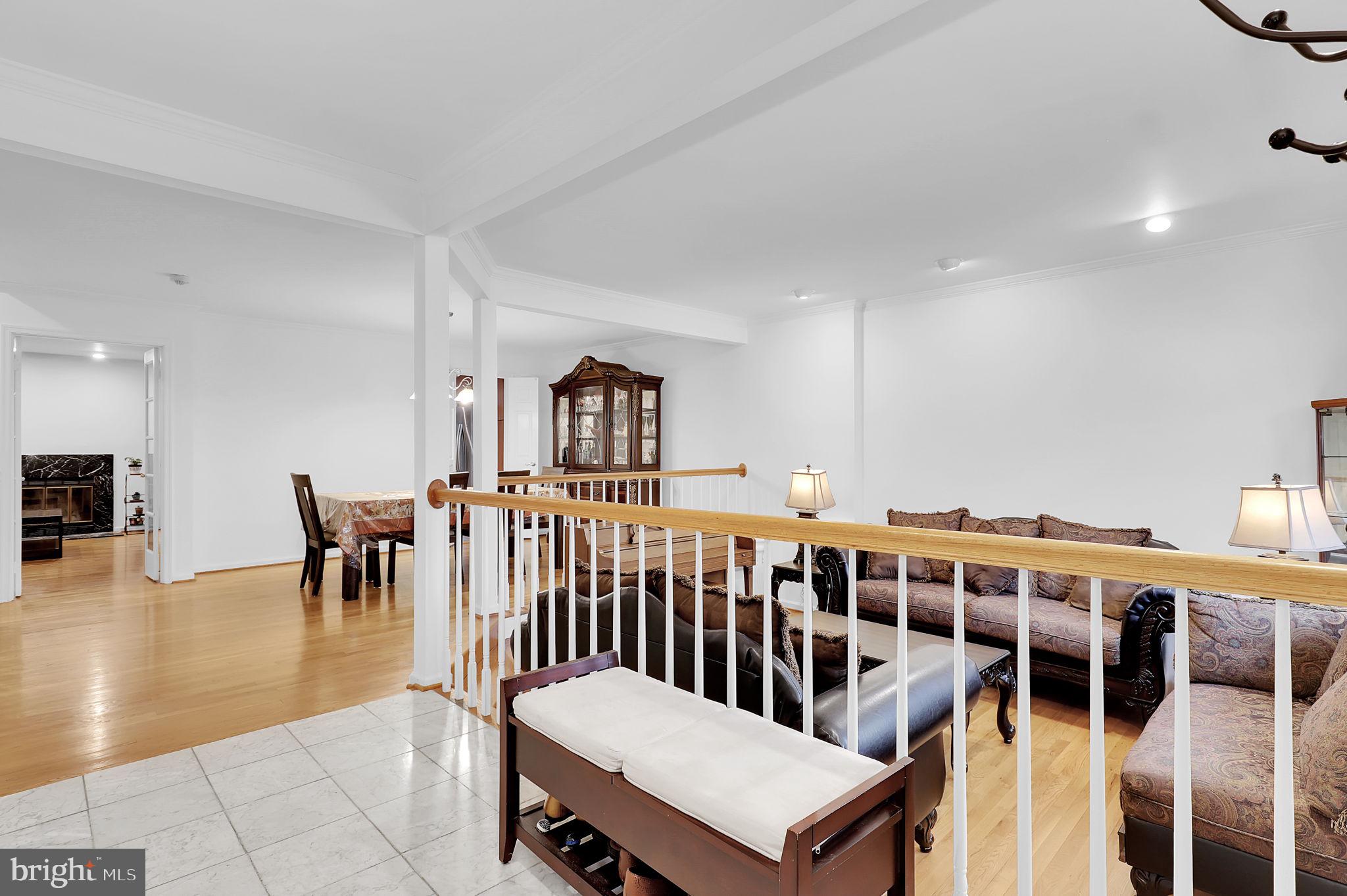 10804 Brewer House Road Rockville, MD 20852 - Photo 4 of 39 a living room with chairs a table and chairs