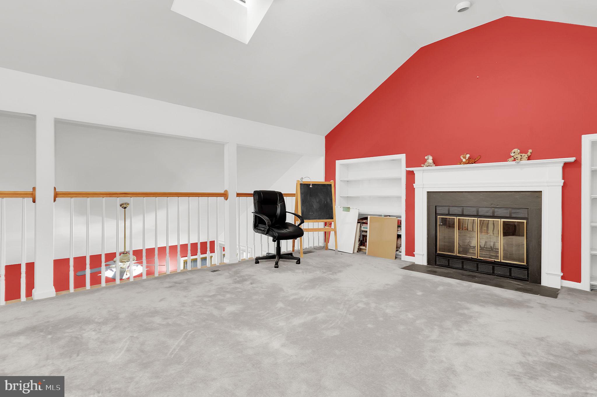 10804 Brewer House Road Rockville, MD 20852 - Photo 42 of 79 a view of an empty room with a fireplace and window