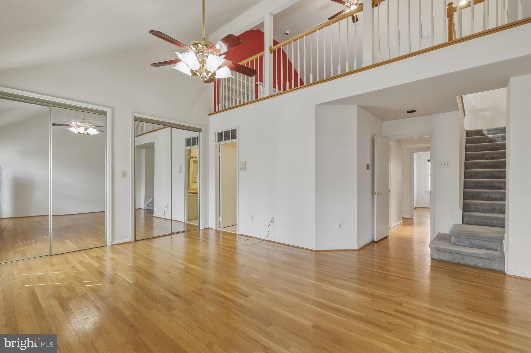 10804 Brewer House Road Rockville, MD 20852 - Photo 43 of 79 a view of an empty room with wooden floor and a ceiling fan