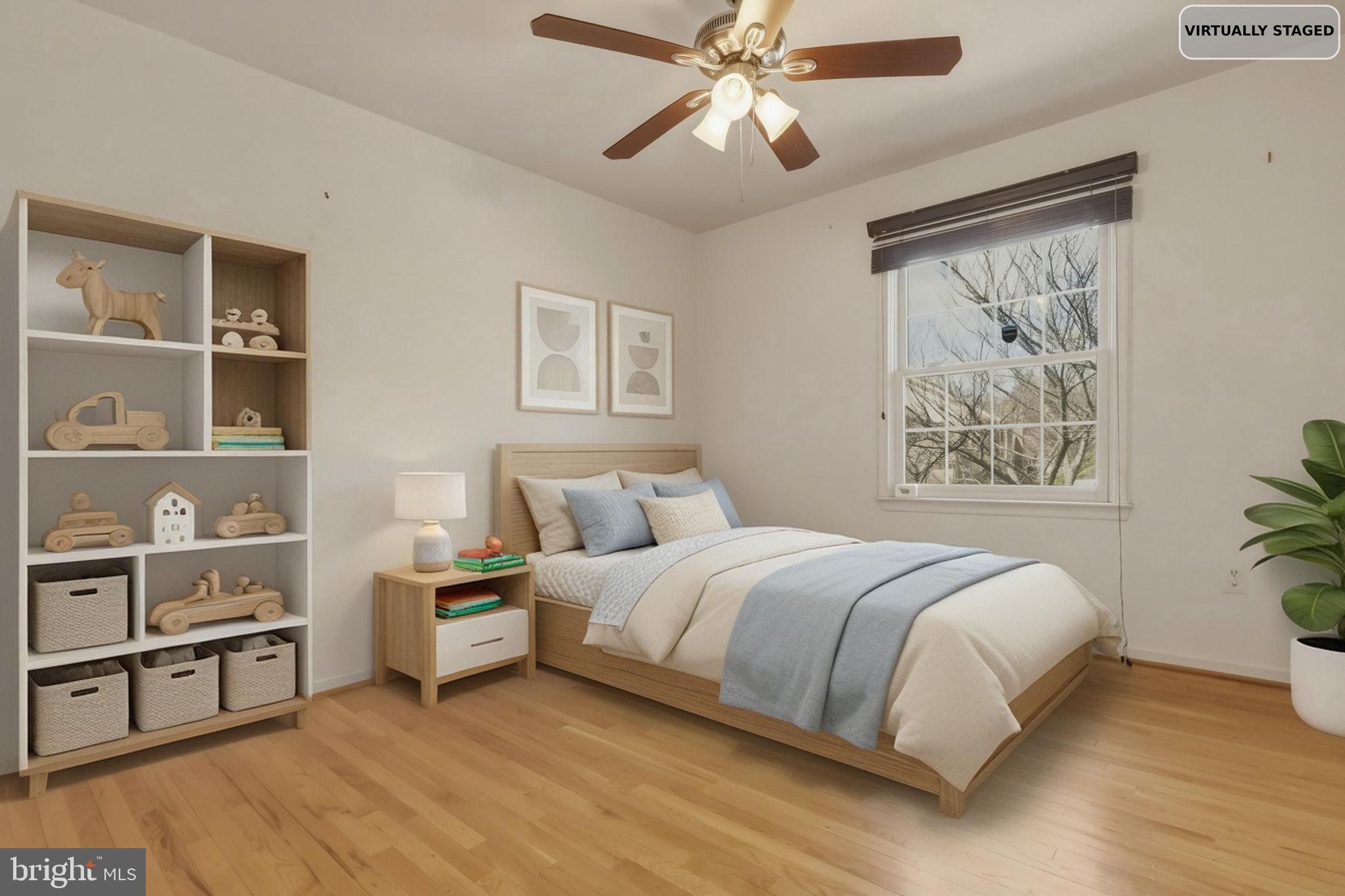 10804 Brewer House Road Rockville, MD 20852 - Photo 64 of 79 a bedroom with a large bed and a chandelier