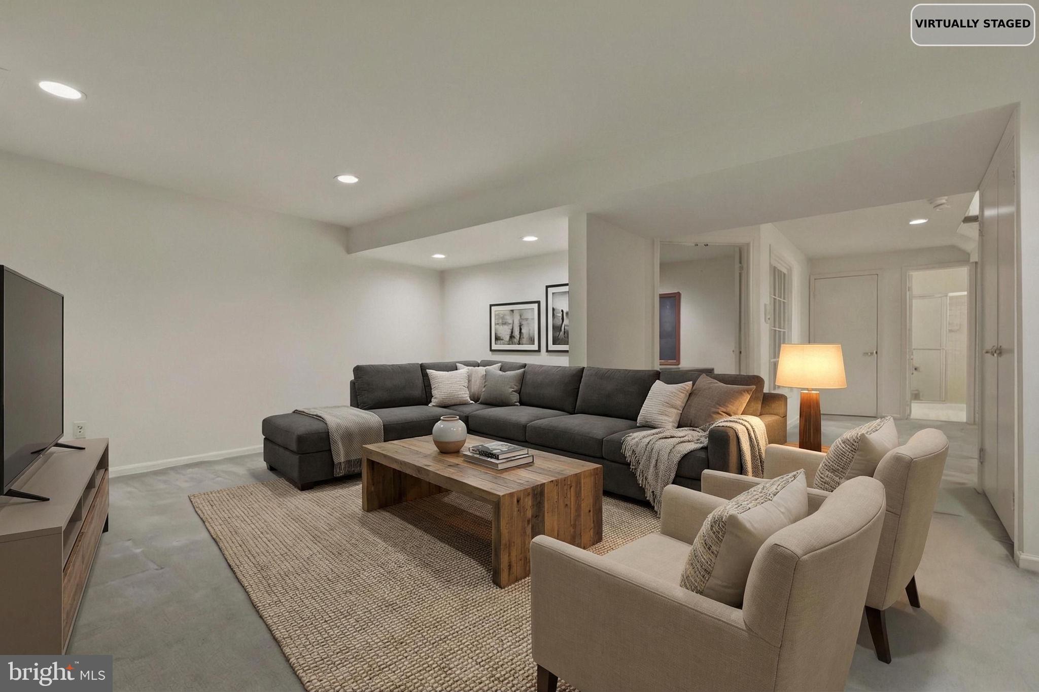 10804 Brewer House Road Rockville, MD 20852 - Photo 74 of 79 a living room with furniture and a flat screen tv