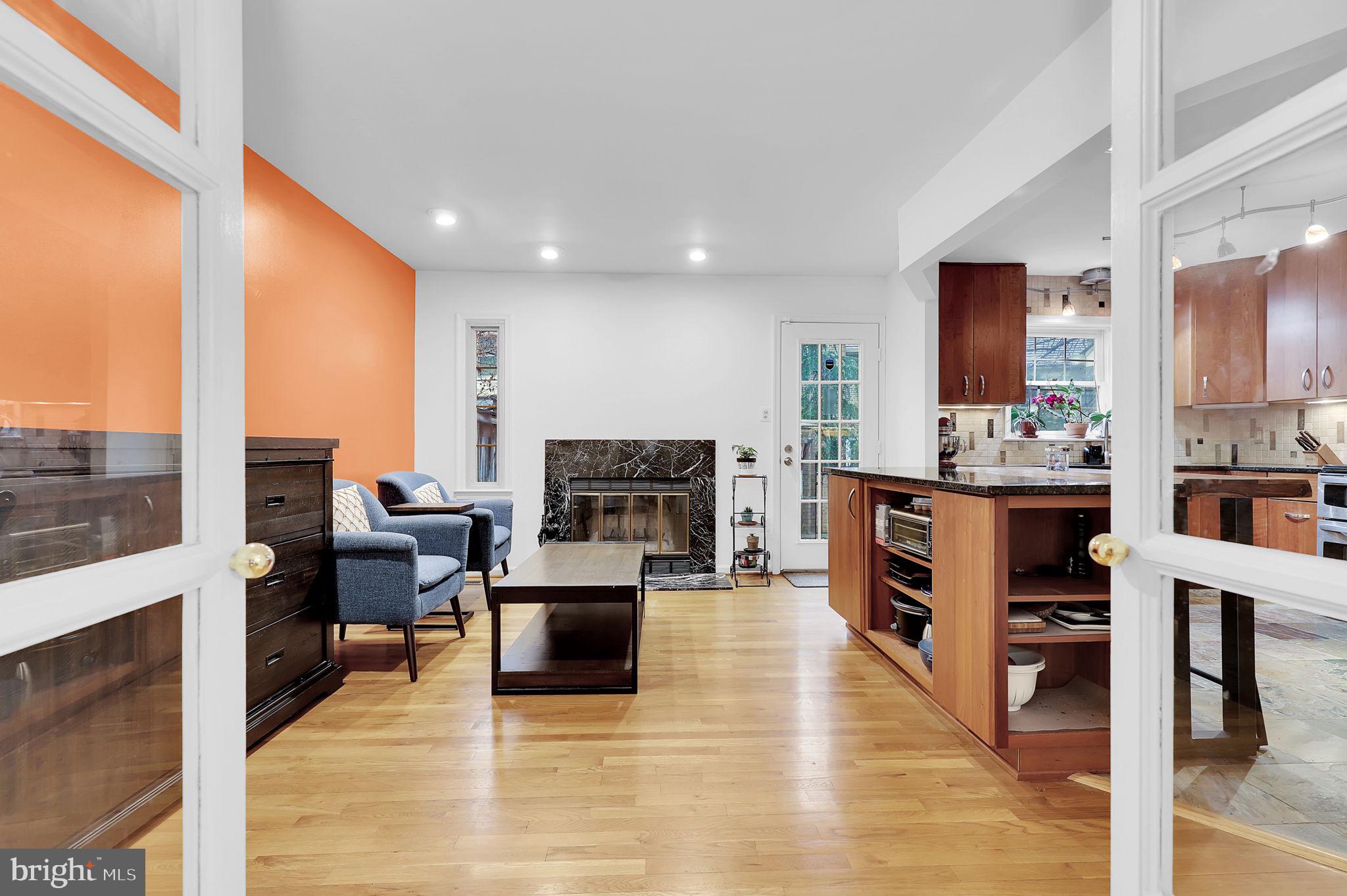 10804 Brewer House Road Rockville, MD 20852 - Photo 9 of 39 a living room with furniture kitchen view and a flat screen tv