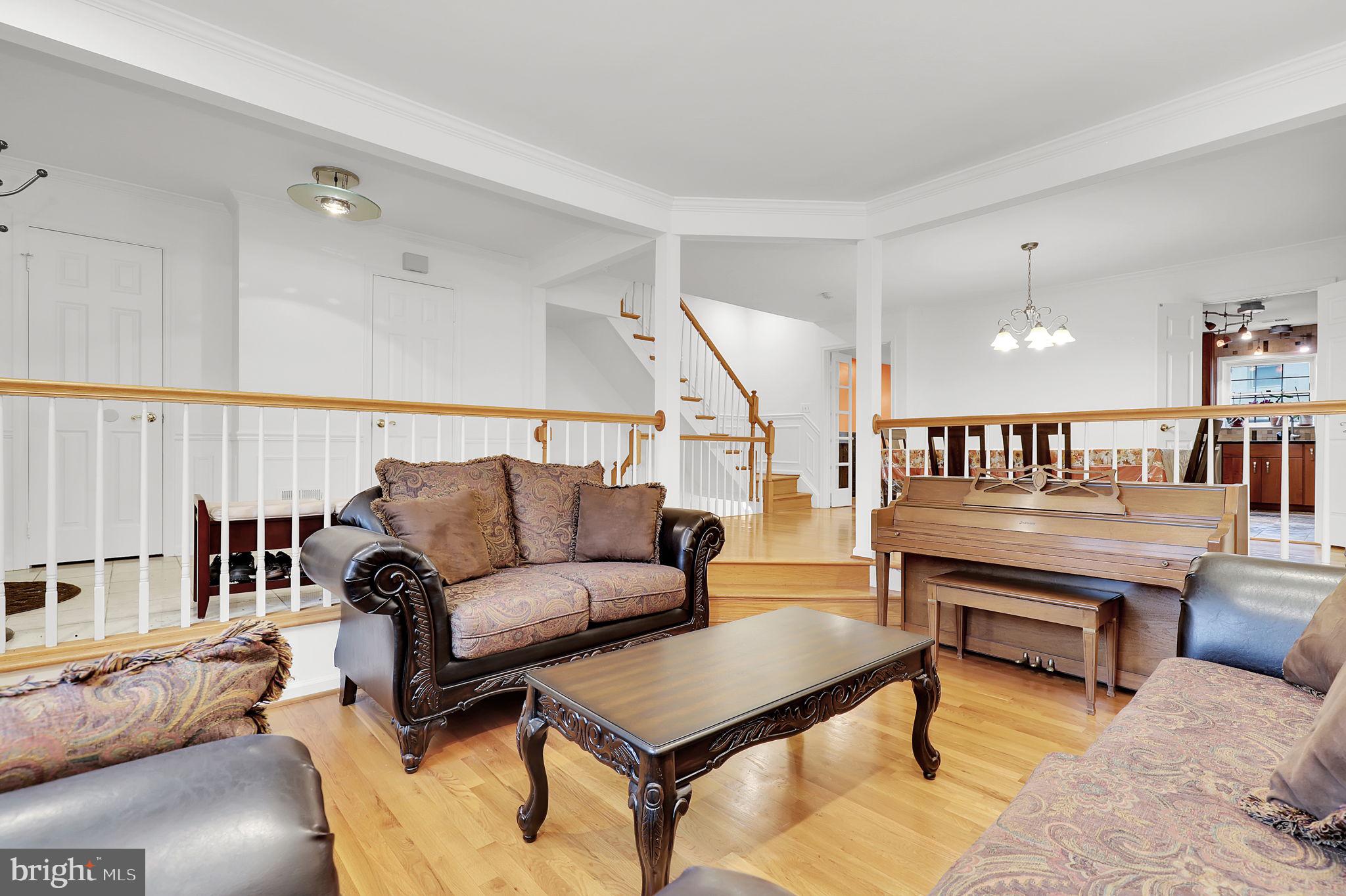 10804 Brewer House Road Rockville, MD 20852 - Photo 10 of 79 a living room with furniture and a rug