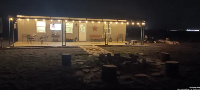 a room with pool table and outdoor seating