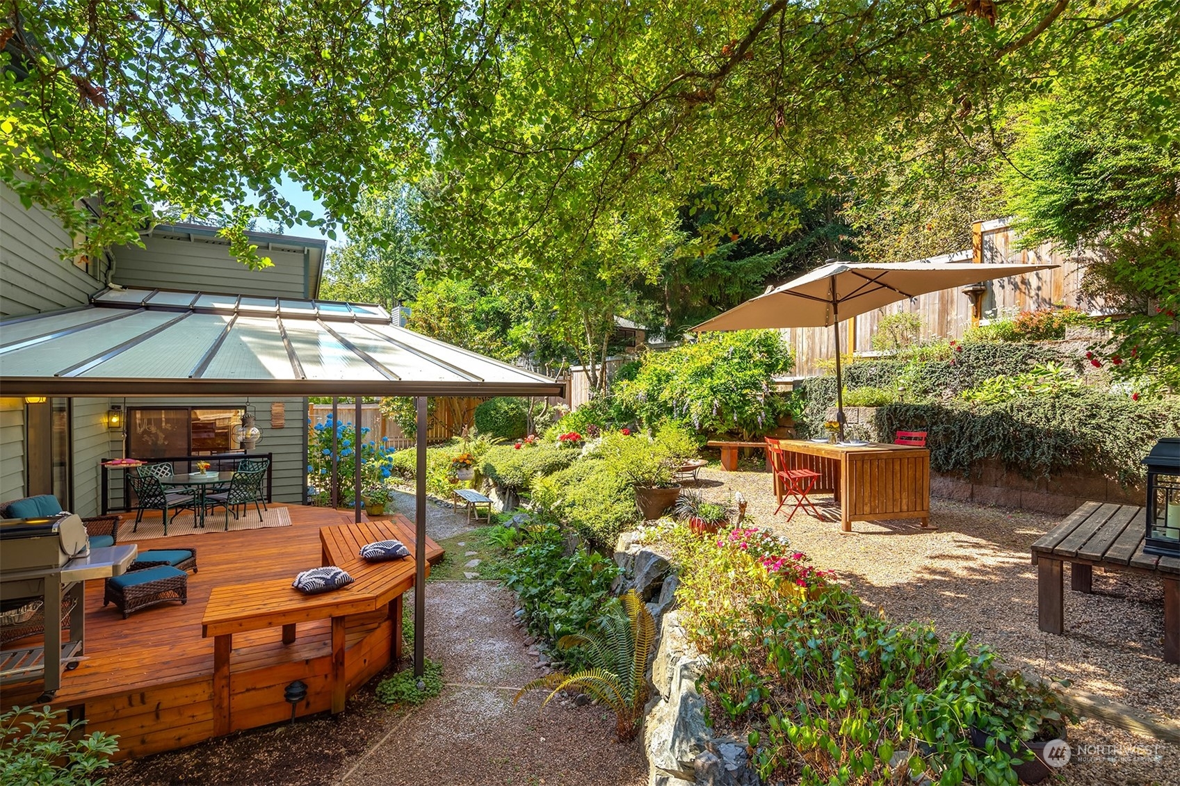 21127 Shell Valley Road Edmonds, WA 98026 - Photo 14 of 40 an outdoor space with furniture and umbrella
