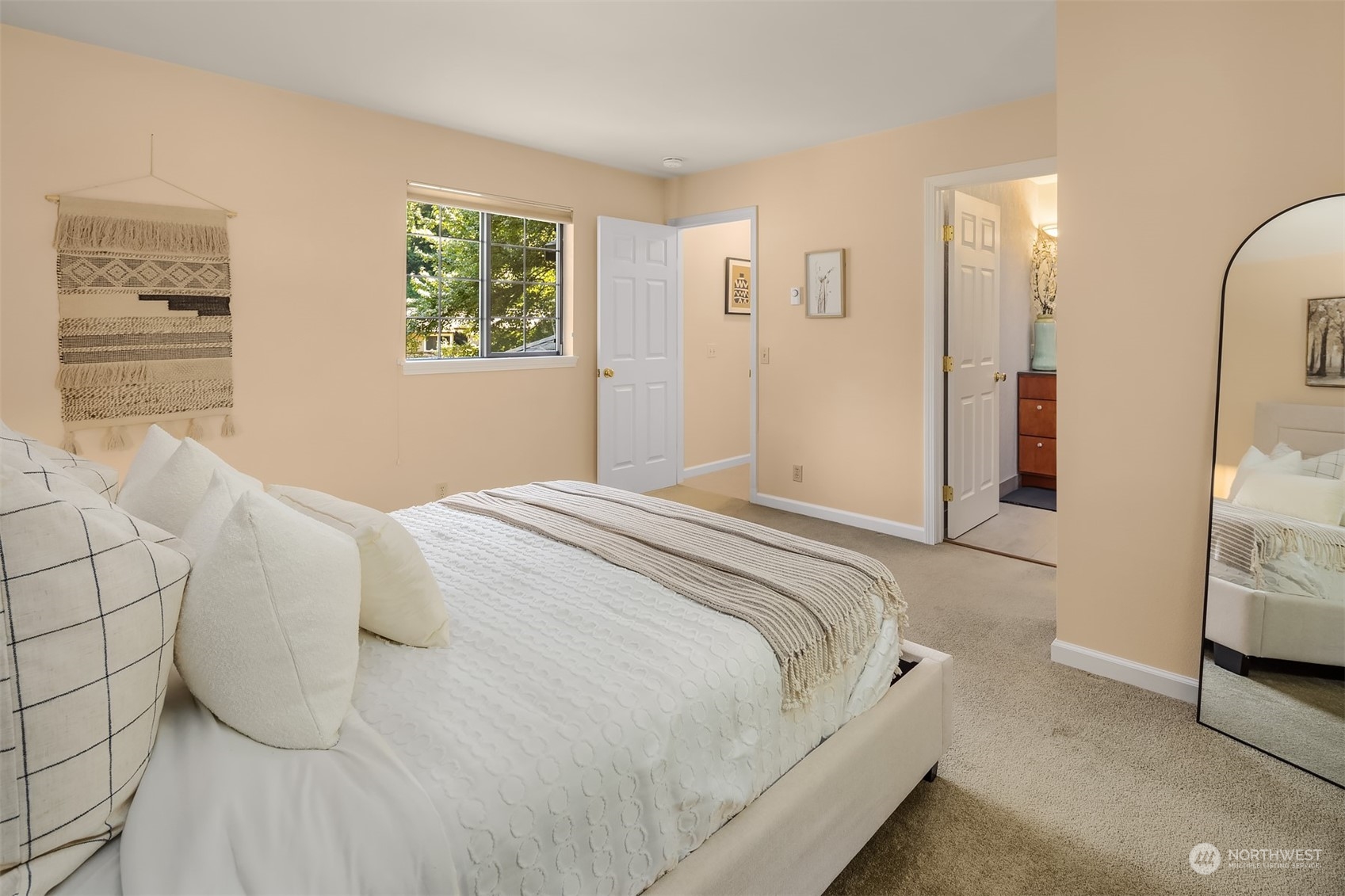 21127 Shell Valley Road Edmonds, WA 98026 - Photo 25 of 40 a bedroom with a bed a mirror and a walk in closet