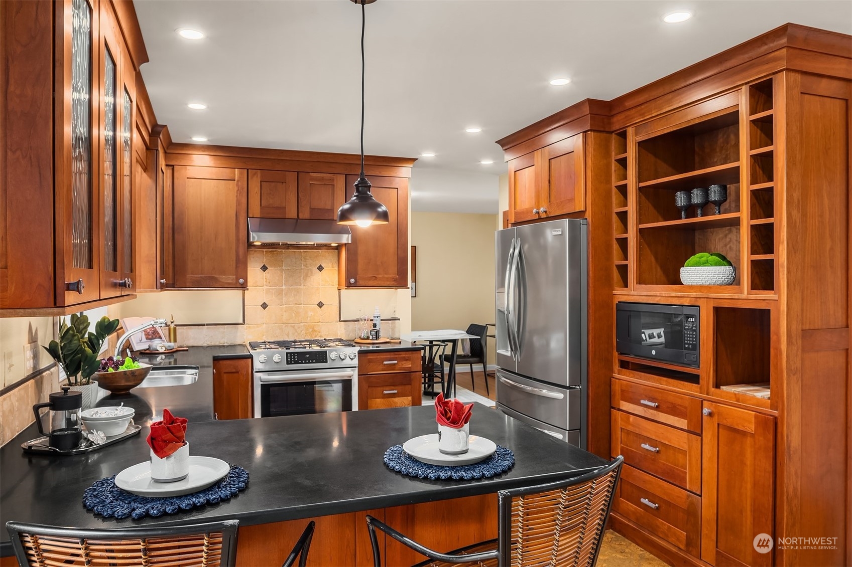 21127 Shell Valley Road Edmonds, WA 98026 - Photo 9 of 40 a kitchen with stainless steel appliances granite countertop a stove and white cabinets
