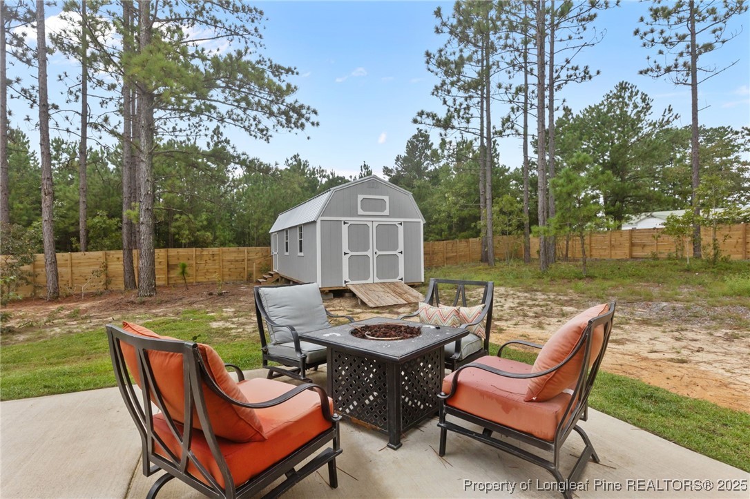 2762 County Line Road Cameron, NC 28326 - Photo 23 of 29 Firepit and Storage Shed