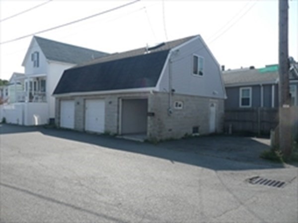 1 Lawrence Road Revere, MA 02151 - Photo 1 of 15 a front view of a house with a garage