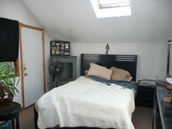 1 Lawrence Road Revere, MA 02151 - Photo 11 of 15 a bedroom with a bed and a potted plant