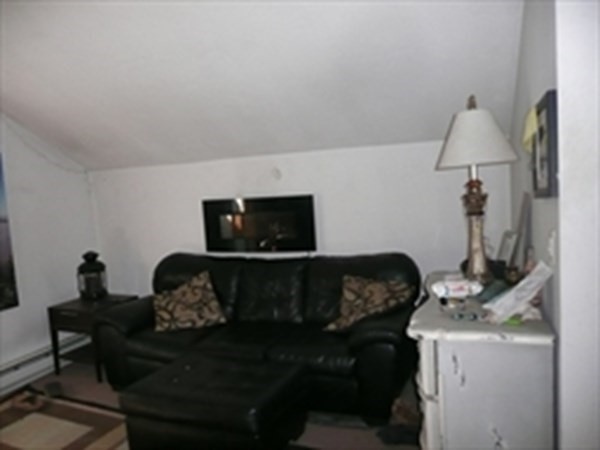 1 Lawrence Road Revere, MA 02151 - Photo 9 of 15 a living room with furniture and a fireplace
