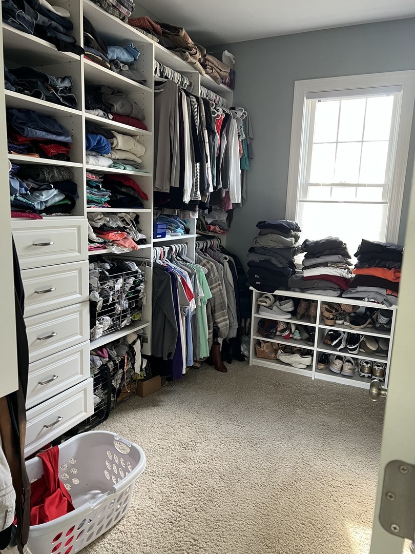 3281 East 19th Road Ottawa, IL 61350 - Photo 13 of 37 a view of walk in closet with clothes and shoes