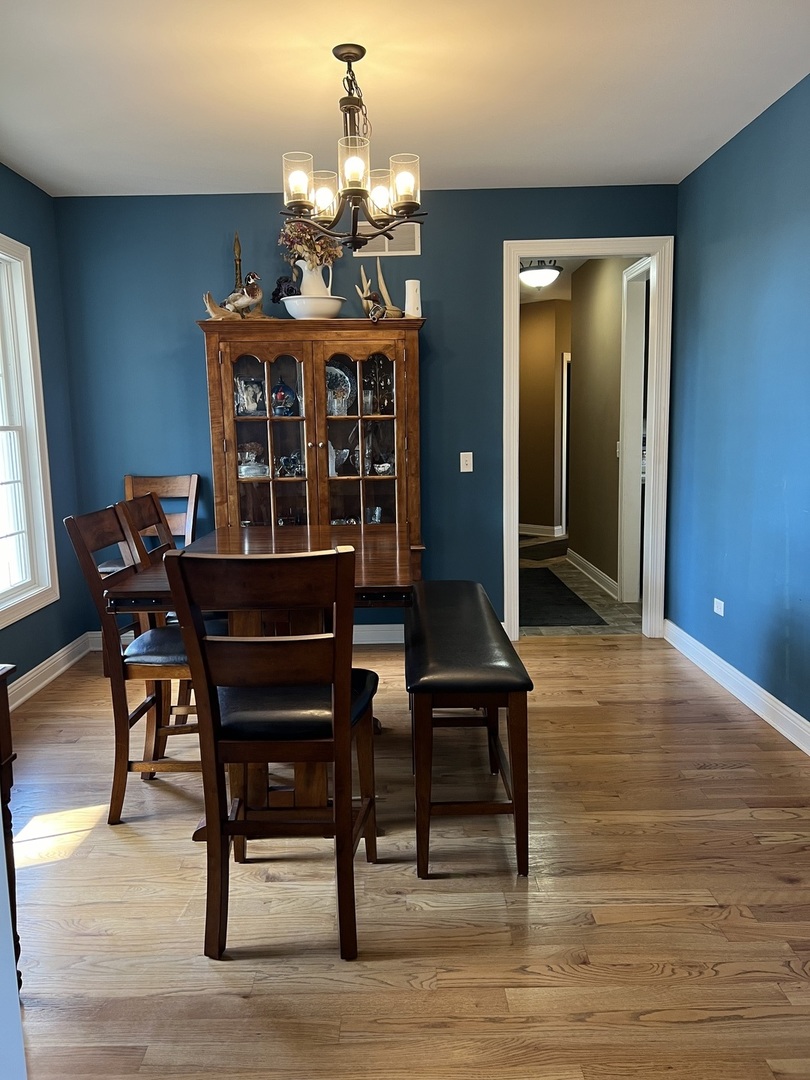3281 East 19th Road Ottawa, IL 61350 - Photo 4 of 37 a view of a dining room with furniture and chandelier