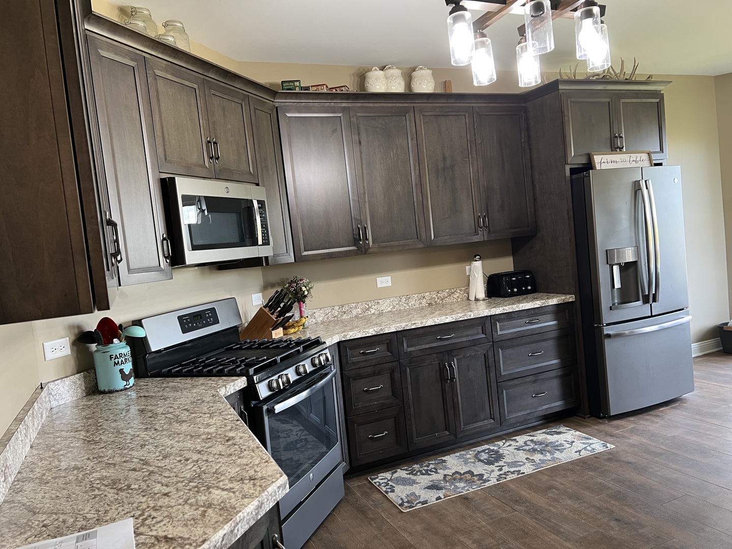 3281 East 19th Road Ottawa, IL 61350 - Photo 6 of 37 a kitchen with stainless steel appliances granite countertop a refrigerator stove and sink
