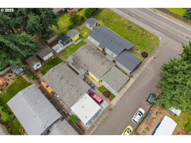 an aerial view of a house with a yard