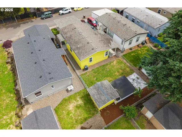 an aerial view of a house with a garden