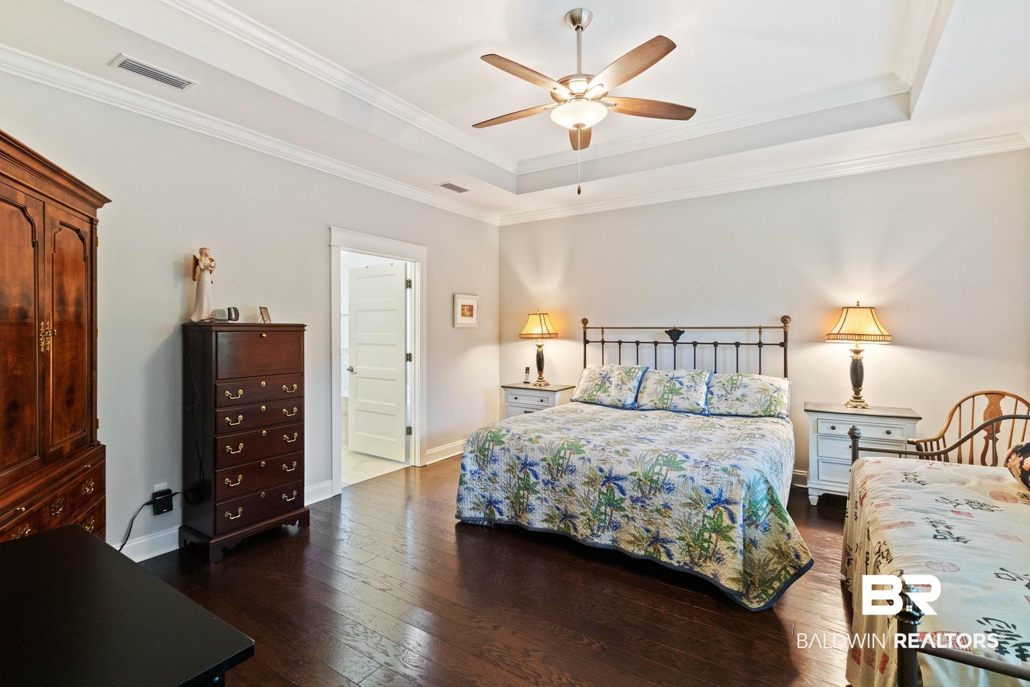 192 Mark Twain Loop Foley, AL 36535 - Photo 19 of 42 Bedroom with a raised ceiling, dark hardwood / wood-style flooring, ornamental molding, and ceiling fan