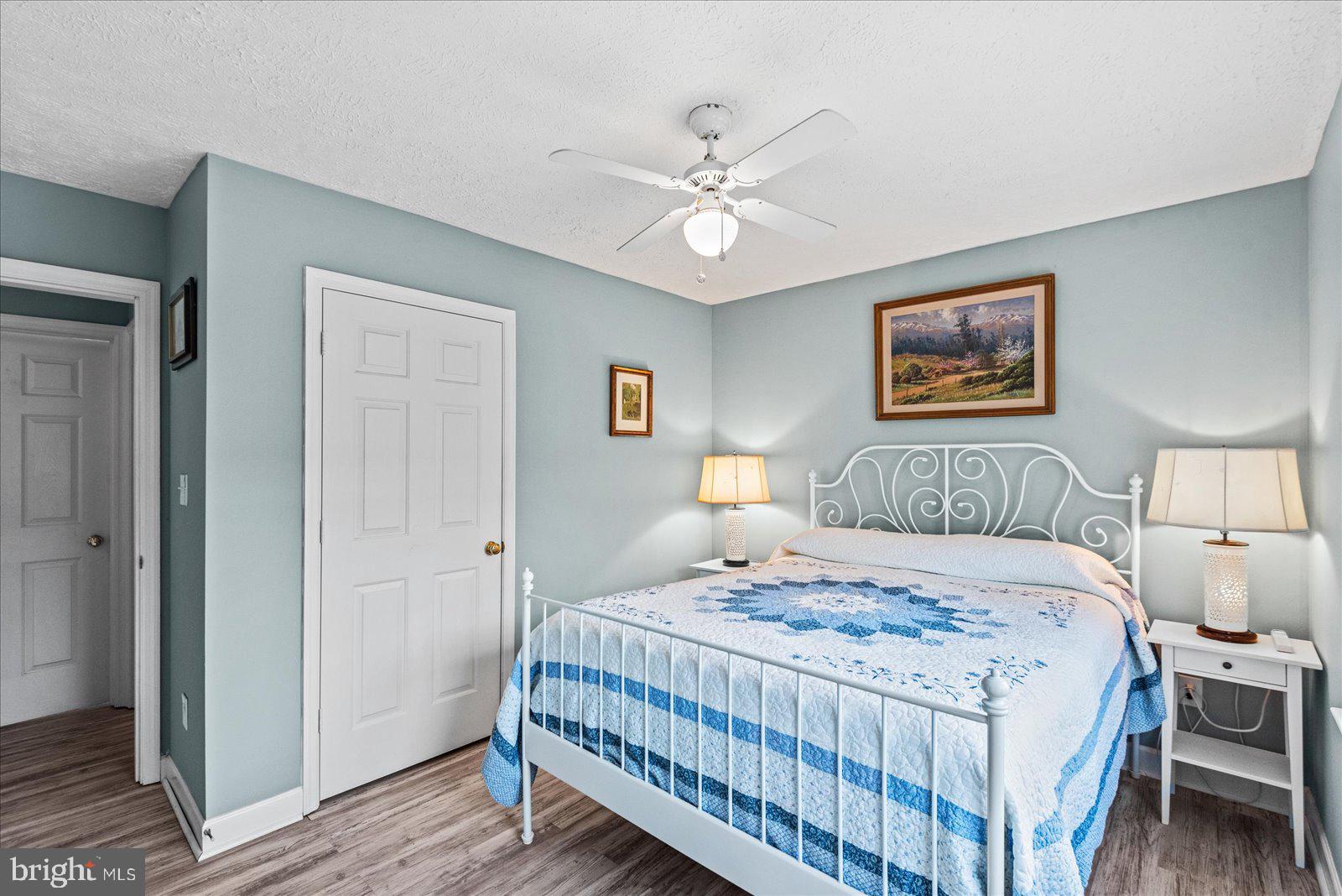 720 Bancroft Avenue Colonial Beach, VA 22443 - Photo 19 of 59 a bedroom with a bed and a chandelier