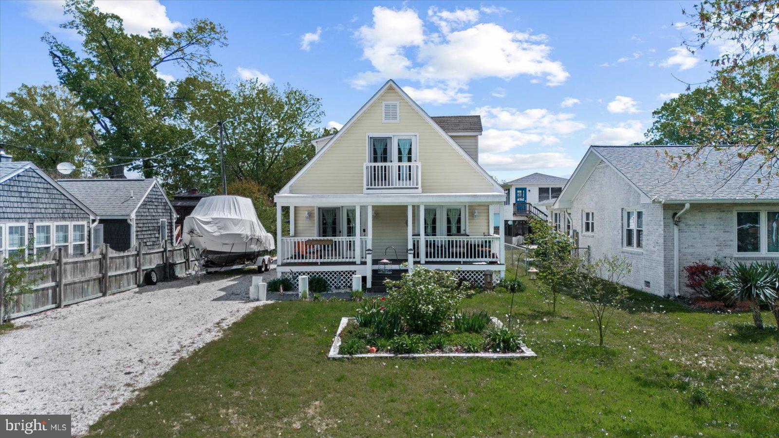 720 Bancroft Avenue Colonial Beach, VA 22443 - Photo 2 of 59 a front view of a house with a yard and porch