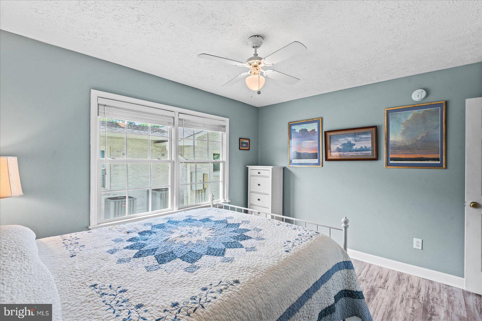 720 Bancroft Avenue Colonial Beach, VA 22443 - Photo 21 of 59 a bedroom with a large bed and a window